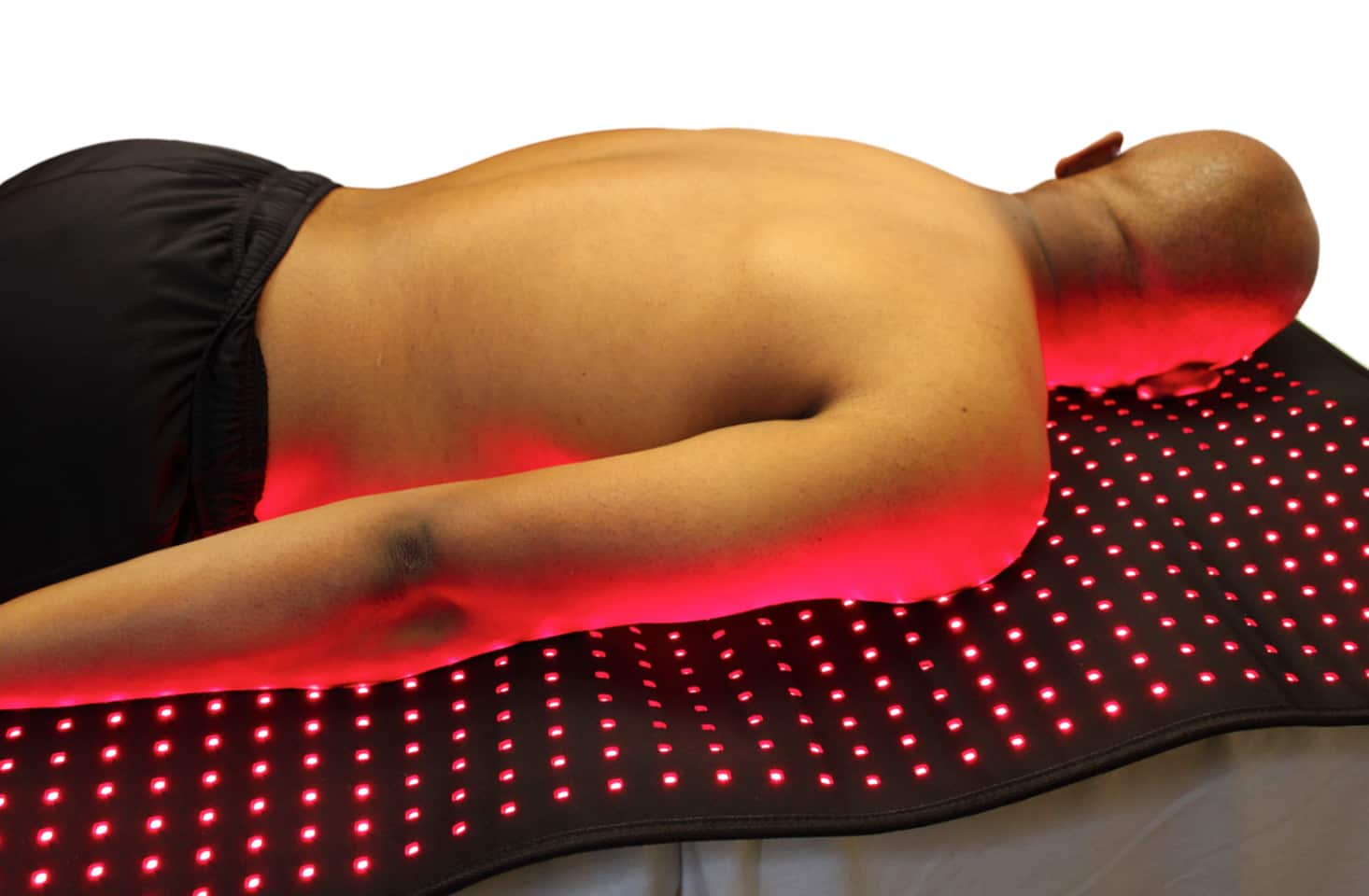 Person laying on light pad.