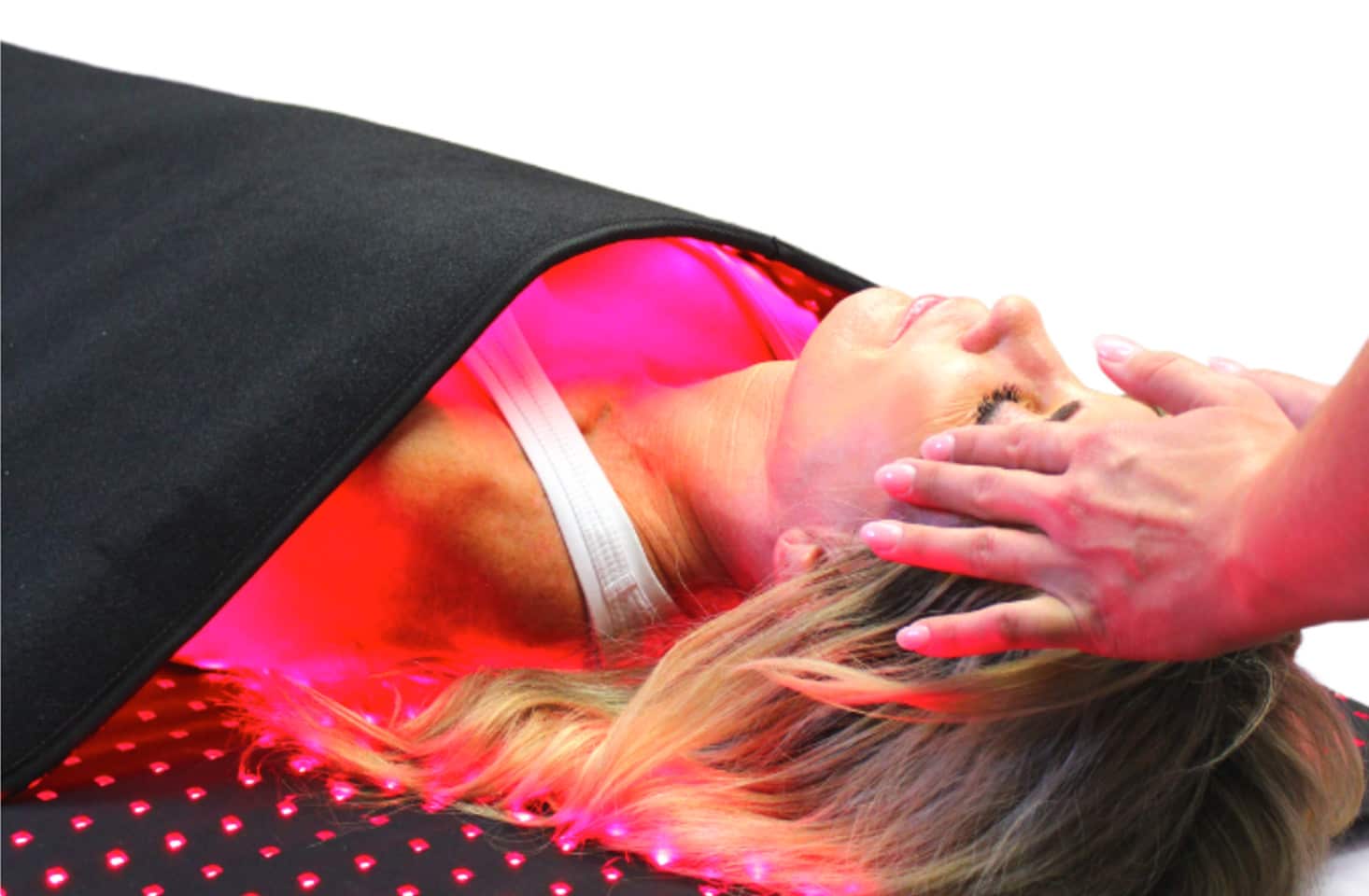 Person with doctor's hands on head.