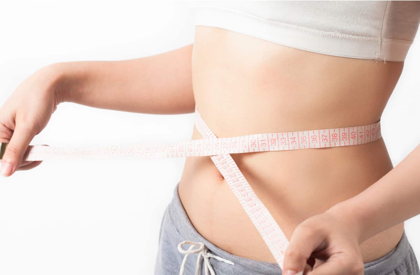 Person with tape measure around waist.